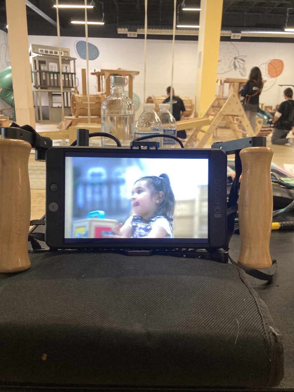 Behind the scenes: monitor playback of a young talent on set