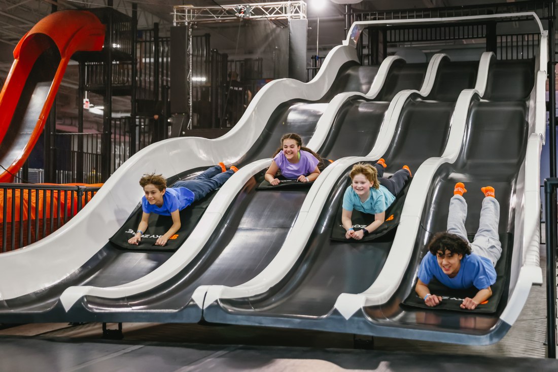 Final asset: kids racing down the Sky Zone slides